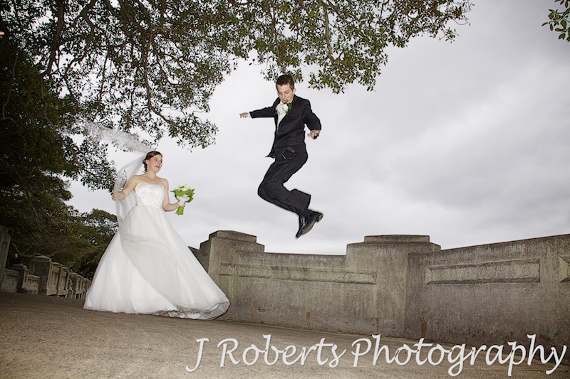 Groom jumping for joy - wedding photography sydney